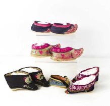 Four pairs of Chinese late 19th / early 20th century Qing Dynasty hand embroidered lotus shoes, of