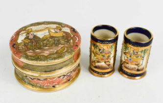 A pair of Meiji period Satsuma miniature vases, of cylindrical form with flared bases, each with a