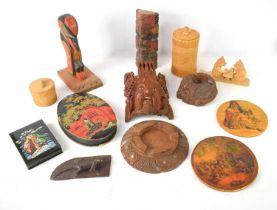 A group of treen to include carved totem pole, Native American lacquered coasters, carved storage