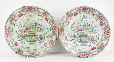 A pair of Qing Dynasty Famille Rose porcelain plates, enamelled with baskets of flowers, and