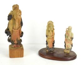 Three Chinese carved soapstone figures of immortals, to include Shou Lao, the tallest measuring 15.