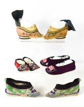 Two pairs of Chinese 19th century Qing Dynasty hand embroidered lotus shoes, each of regional