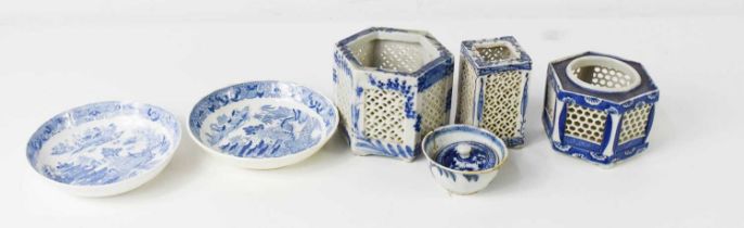 A group of Chinese slab sided blue and white pots, with pierced sides, the largest of octagonal