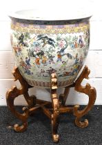 A large Chinese Famille-Rose fish bowl on stand depicting figural scenes, 47cm high by 55cm.