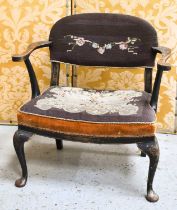 An early 20th / late 19th century elbow chair, decorated in the Chinese fashion with Chinoiserie