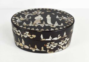 A Chinese black lacquered and mother of pearl inlaid oval box, depicting figures engraved with