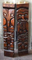 Two New Zealand wooden tribal carvings, the owl and other animals having Paua shell eyes, 89cm