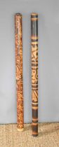 Two Australian Aboriginal didgeridoos, 121cm.