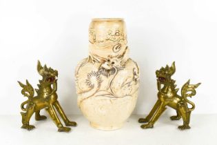 A stoneware Japanese vase, modelled in relief with a dragon set with glass eyes, together with two