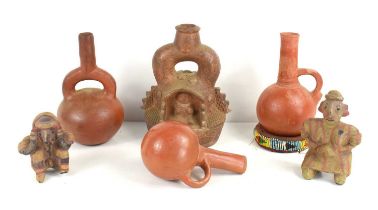 Three South American terracotta jars, one jar bearing incised decoration, together with a