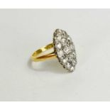 An 18ct gold and diamond ring, the diamonds set in a navette shape comprising 15 old cut diamonds,