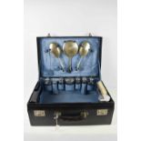 A lady's vintage dressing case complete with silver topped jars and leather blotter, and with