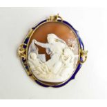 A Victorian gold enamel cameo mourning brooch / pendant, depicting mother and son praying over a