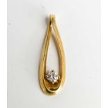 A 14ct gold and diamond pendant, the tear drop cross over twist pendant set with single diamond of