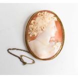 A Victorian cameo brooch, intricately carved to depict a female profile portrait, in a yellow