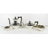 A silver tea service comprising tea pot, hot water pot, slop bowl and milk jug, Birmingham 1938,
