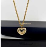 A Chopard, 'Happy Diamond', pendant heart necklace, the glazed locket set with five floating