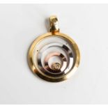 A 9ct gold and floating stone pendant, likely diamond set within three concentric floating rings,