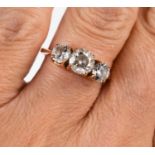 A 14ct rose gold and cubic zirconia three stone dress ring, size L, 2.8g.