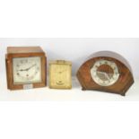 Three vintage mantle clocks to include a 1930s Garrard oak cased clock presented to Bro S.H Thomas
