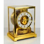 A Jaeger-Le-Coultre Atmos mantle clock, serial number 489216, the recessed white chapter ring with