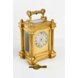 A 19th century gilt bronze Payne of London carriage clock, the silvered Roman numeral dial decorated