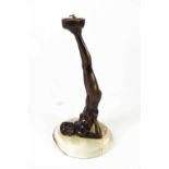 An Art Deco bronze style lamp base in the form of a nude woman, with onyx base, 31cm high.