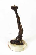 An Art Deco bronze style lamp base in the form of a nude woman, with onyx base, 31cm high.