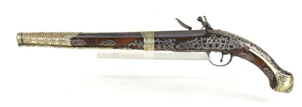 A late 18th century highly decorated flintlock pistol with inlaid silver decoration throughout,