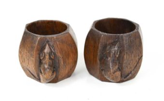 A pair of Robert Thompson 'Mouseman' napkin rings, both bearing the carved mouse trademark.