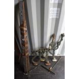 A pair of cast iron and painted bench ends in the form of serpents or snakes.