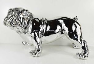A silvered plaster figure of a bulldog.
