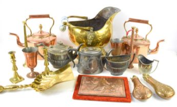 A quantity of metalware to include copper kettles, copper powder flasks, brass coal scuttle,