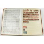 A stamp album containing GB stamps, including sixty-four Penny Red's and other examples.