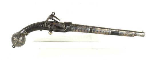 A 19th century Turkish flintlock pistol, the steel barrel overlaid with decorated silvered panels,