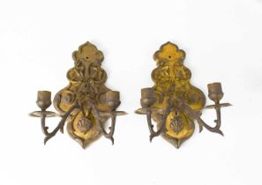 A pair of gilt metal French 19th century wall sconces, the cast embossed backplates emanating twin