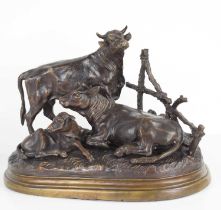 After Jules Moignez (French 1835-1884): a bronze figure group of a bull, cow and calf, signed to the