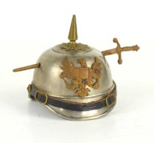 WW1 Trench Art: An inkwell made in the form of a German soldiers Pickelhaube helmet.