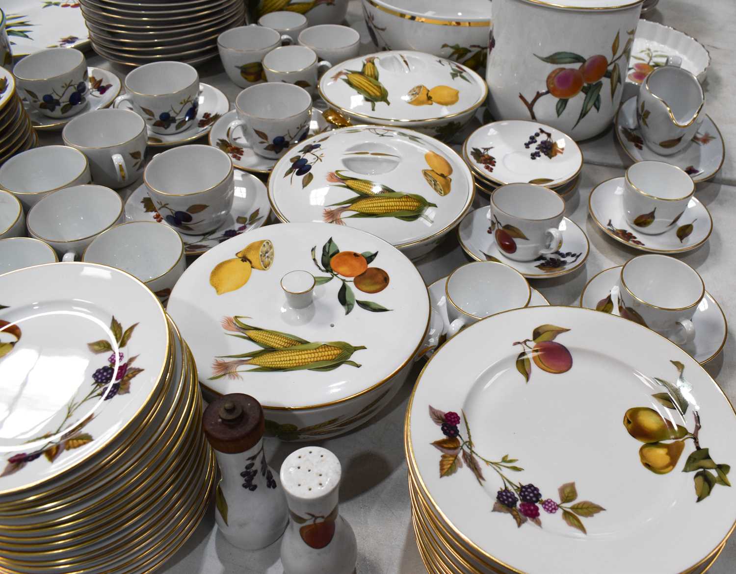 A Royal Worcester part dinner service in the Evesham pattern comprising, twelve dinner plates and