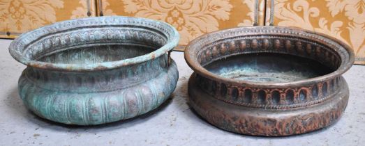 A similar pair of 19th century Italian style copper wine coolers, one with a green patination and