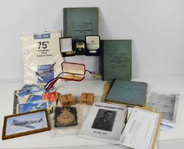 A group of militaria, to include RAF note books to W.L Ball F/LT 3503705, First Day Covers including