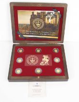 A cased set of eight 24ct gold coins commemorating 200 Years of the British Empire, each coin weighs