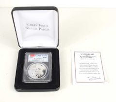 A Danbury Mint 2019 early issue solid silver panda coin struck by the China mint, with original