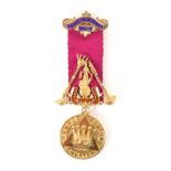 Masonic Interest: A 9ct gold jewel on ribbon, Temple Fortune Chapter, the jewel set with a pink