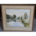 A 20th century watercolour of a river scene, apparently unsigned, 39 by 49cm, framed and glazed.