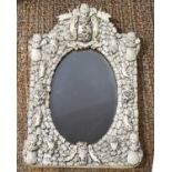 An impressive 19th century French Dieppe bone carved mirror, possibly made by a prisoner of war, the