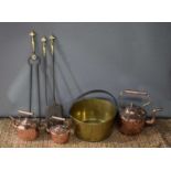 A 19th century brass jam pan together with three copper kettles and a fireside companion set,