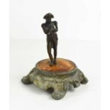 A bronze figure of Napoleon, 19th century, raised on an associated wooden and cast metal base,