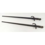 Two French model 1874 bayonets, one marked St Etienne and dated 1876, both with scabbards.