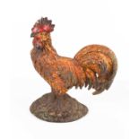 An American antique door stop in the form of cockerel, with original residual paintwork, 22cm high.